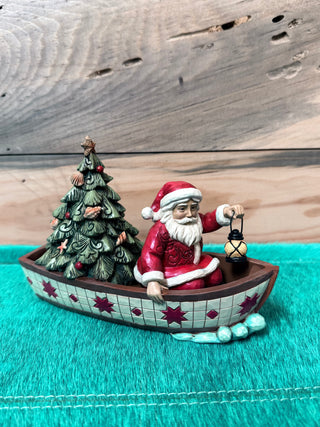Santa in Boat with Tree Figurine