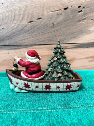 Santa in Boat with Tree Figurine