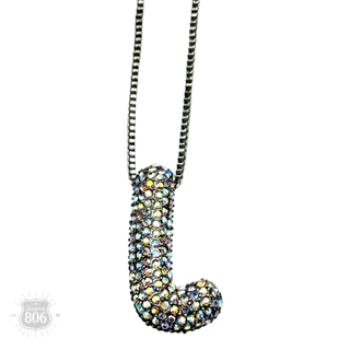 Rhinestone letter pendant on silver necklace