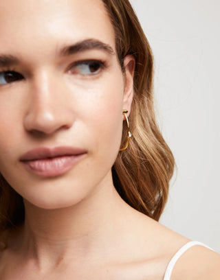 Ser Indomable Gold - Hoop earrings with white topaz