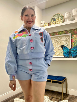 QOS Dusty Blue Jewel Button Flower & Sunglasses in Pocket Sweatshirt - Boutique Bella BellaQueen of Sparkles
